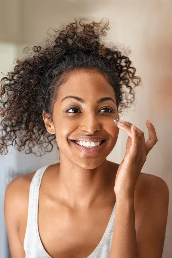 woman touching her face in concern